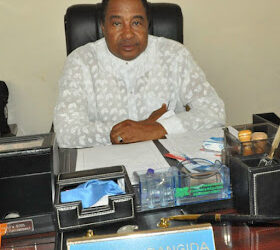 Alhaji Garba A. Dangida in his office - in those days!