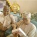 Gen. Babangida reads the blurb as I look on with interest